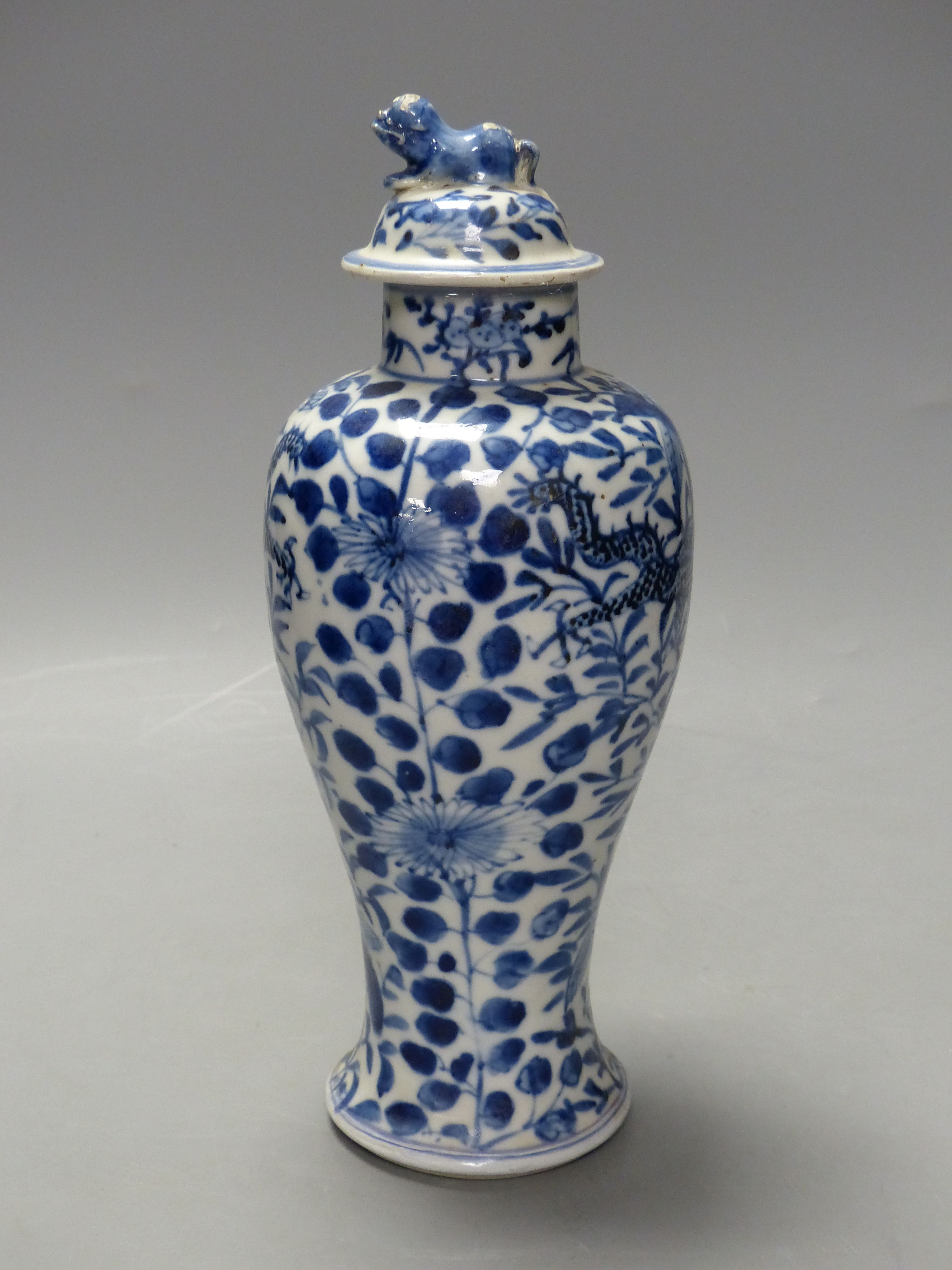 A 19th century Chinese blue and white dragon vase and cover, height 27cm